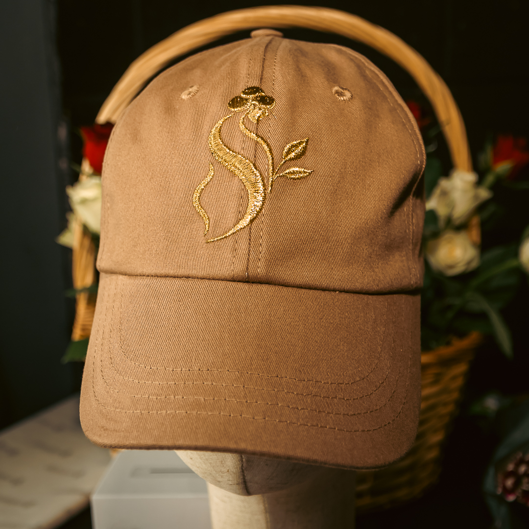 Tan Softaholic cap with gold embroidered emblem
